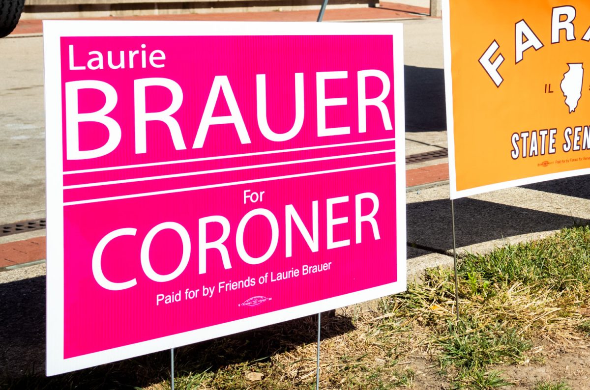 A sign stands outside of the Illini Union on Oct. 24 promoting Laurie Brauer for Coroner. 