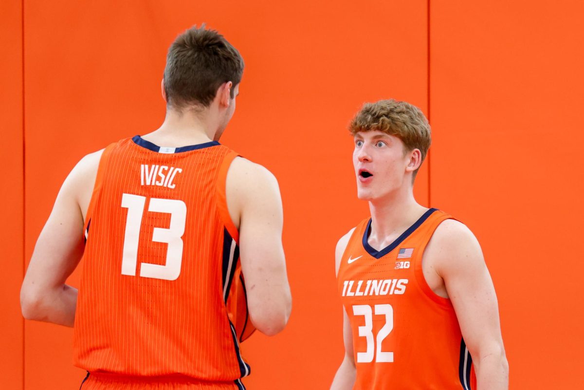 Freshmen guard Kasparas Jakucionis reacts to freshman center Tomislav Ivisic at media day on October 11. 