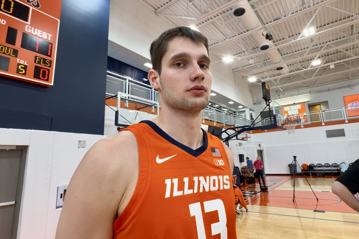 Illini center Tomislav Ivisic speaks to reporters at media day on October 11