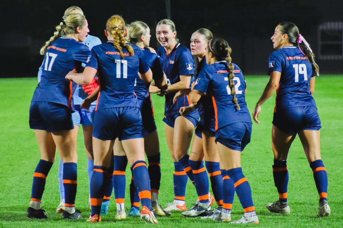 Illinois soccer huddles following a goal on Oct. 10 vs. USC