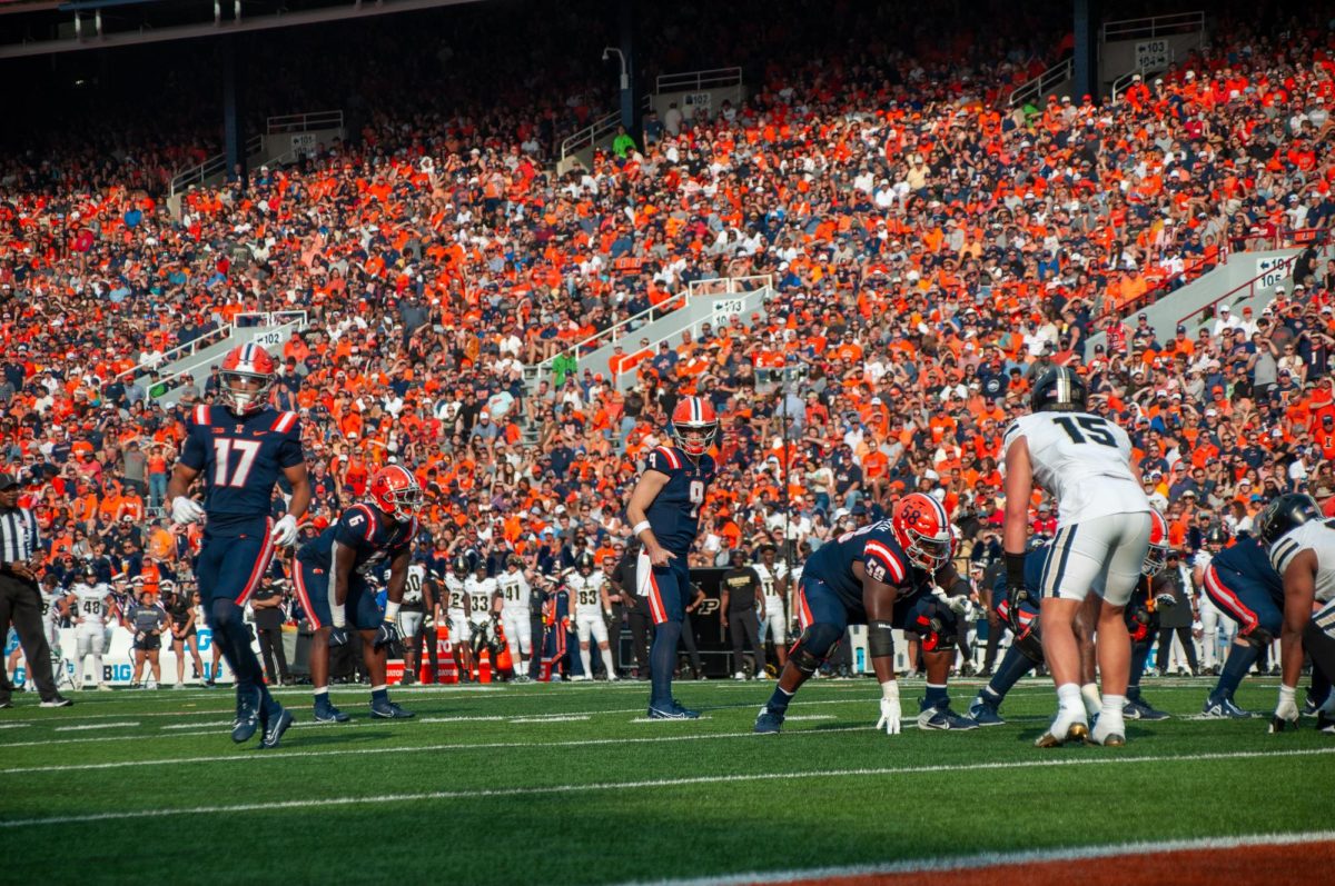 Junior quarterback Luke Altmyer gets ready for a play against Purdue on Oct. 12.