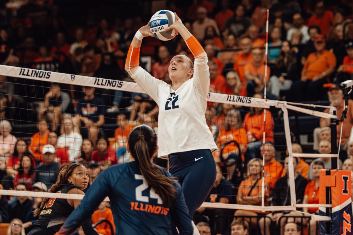 Redshirt-junior Brooke Mosher sets for graduate student Christina Martinez Mundo at the net on Oct. 20 at Huff Hall.