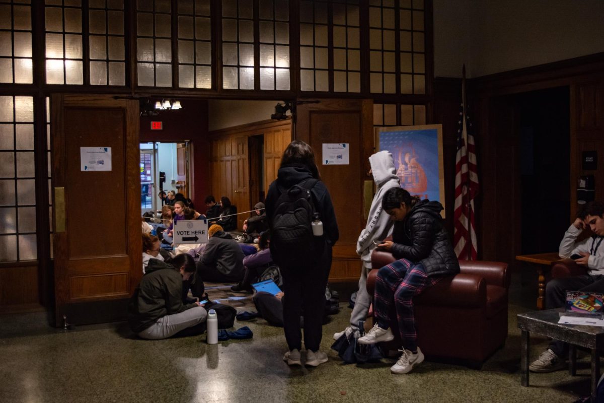 Voters wait in line at the University YMCA at 8:03 a.m. Polls opened at 6 a.m. 