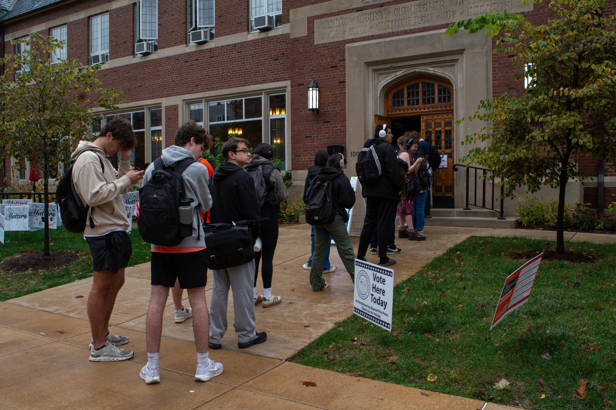 Students wait in line to vote at the University YMCA at 12:37 p.m.