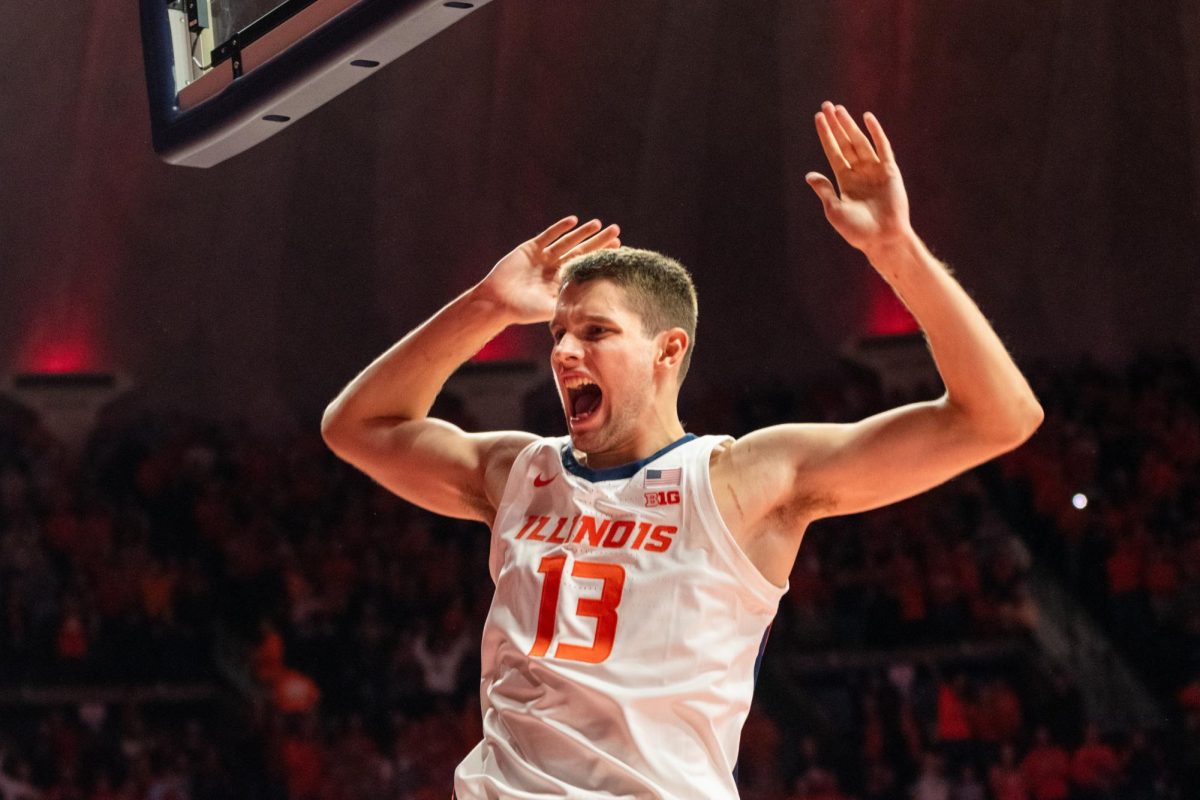 Sophomore center Tomislav Ivisic opens the game Friday night with a dunk against Southern Illinois University-Edwardsville on Nov. 8 at State Farm Center.