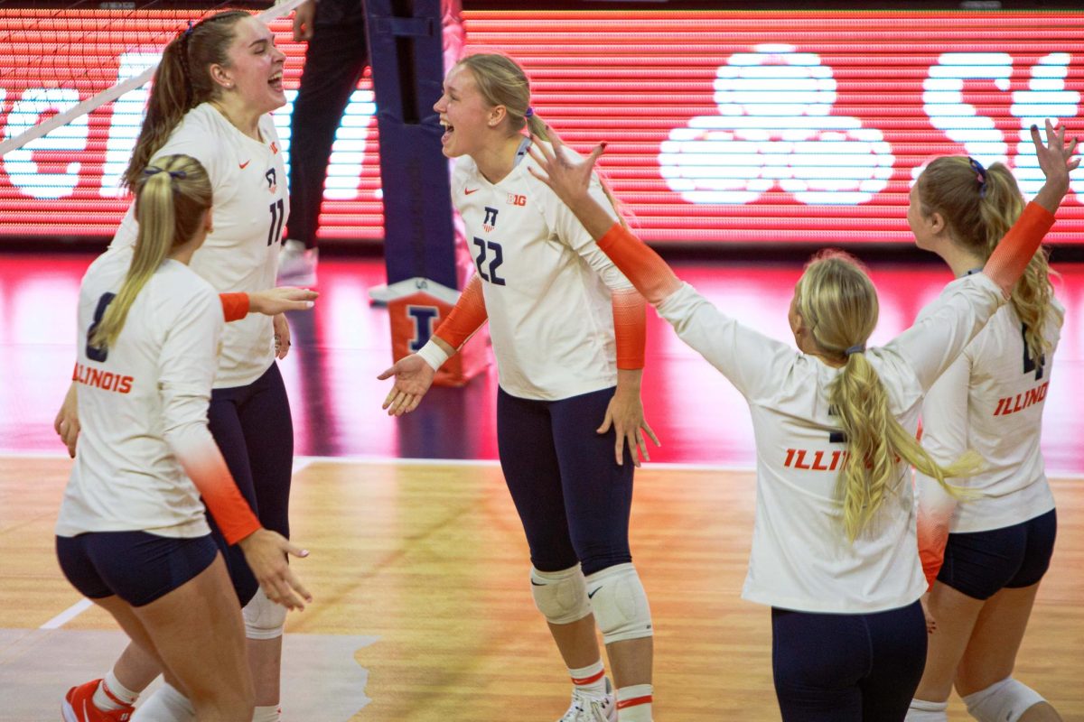 Illinois volleyball celebrates a point during a 3-0 victory over Ohio State on Nov. 9.