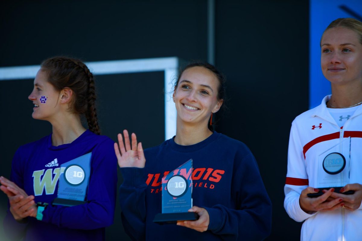 Senior Halle Hill accepts her award at the Big Ten championships on Nov. 1 after breaking the programs 6k record. 