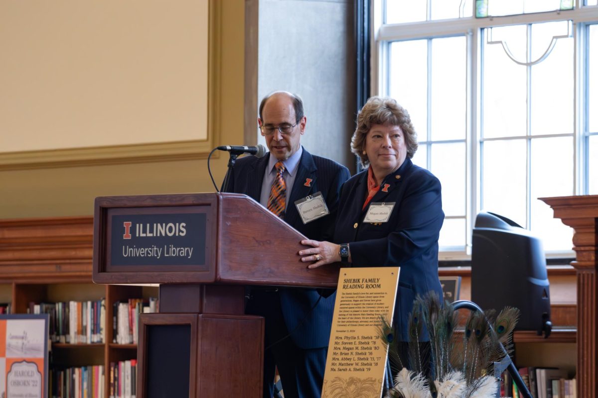 Steven and Megan Shebik speak at the University of Illinois Main Library on Friday, announcing the naming of the Shebik Family Reading Room during the Library's 100th-anniversary celebration.