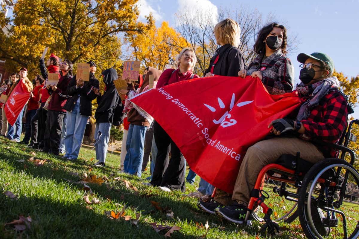 Young Democratic Socialists for America hold a demonstration protesting the University's new speech policies Wednesday. The demonstration highlighted rules restricting the volume of protests and the height of structures.