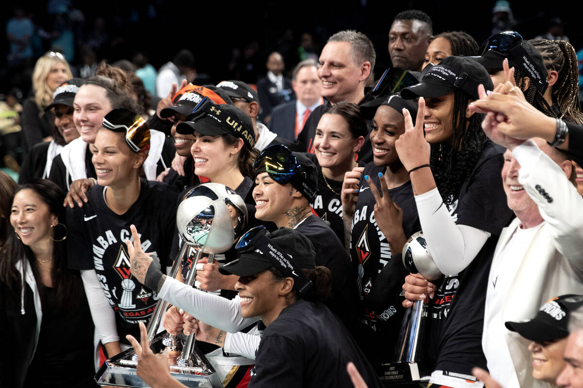 The Las Vegas Aces pose with their trophy after winning Game 4 of a WNBA basketball final series against the New York Liberty to take the championship at Barclays Center on Wednesday, Oct. 18, 2023, in Brooklyn, NY. (Ellen Schmidt/Las Vegas Review-Journal/TNS)