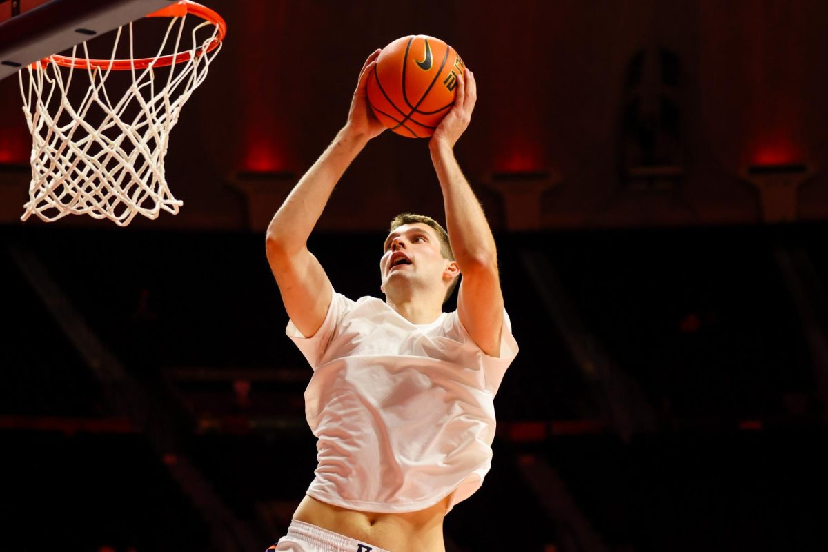 Sophomore center Tomislav Ivisic dunks the ball in warm ups ahead of Illinois' matchup with Oakland on Nov. 13.