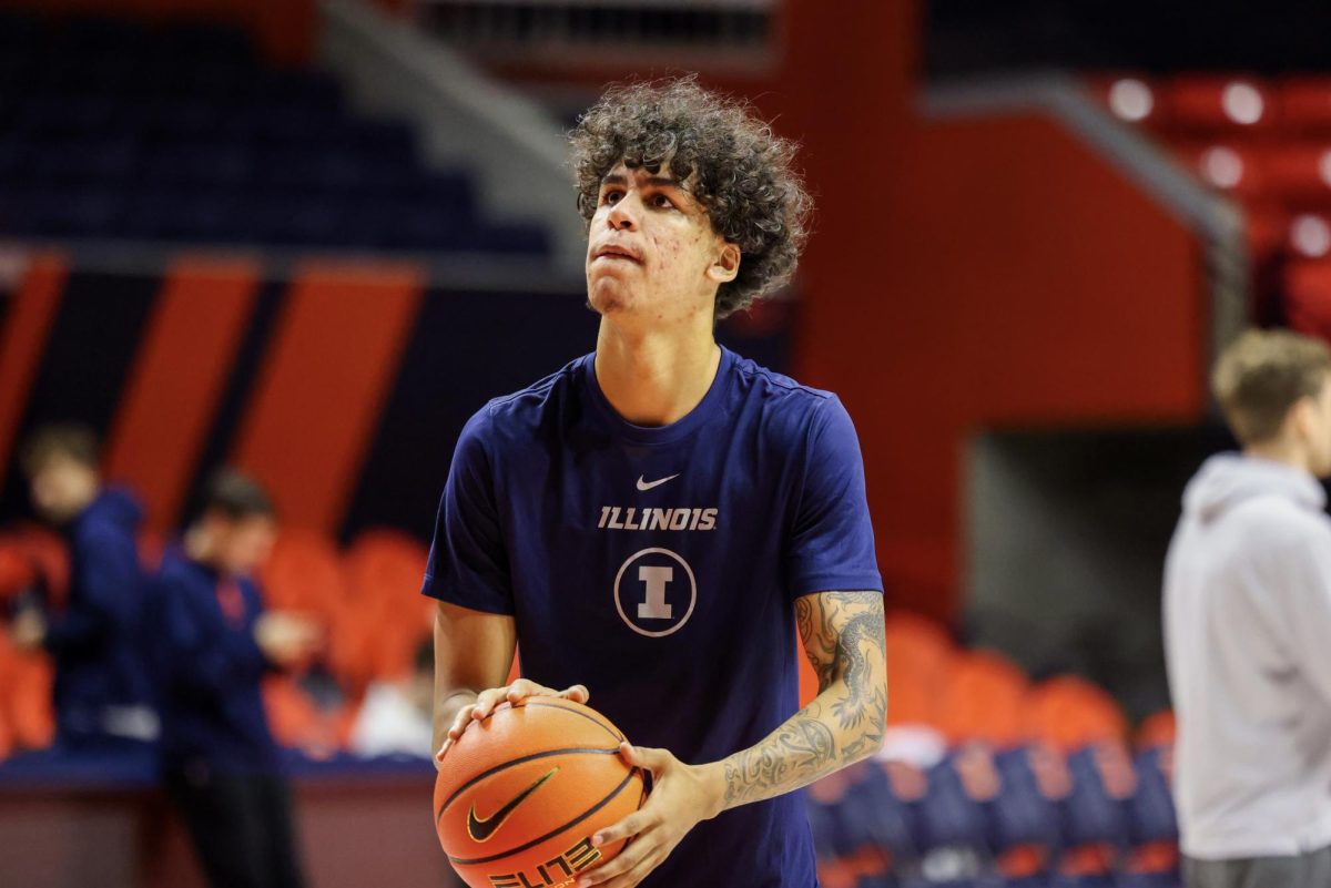 Freshman forward Will Riley shoots a free throw during practice on Nov. 22 at State Farm Center.