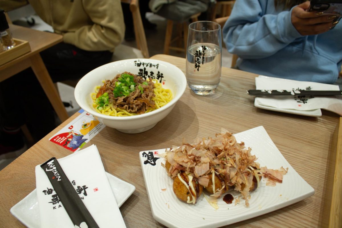 A Takoyaki appetizer and Sukiyaki noodle dish at Kajiken Ramen, a new Japanese restaurant on Green Street in Champaign.