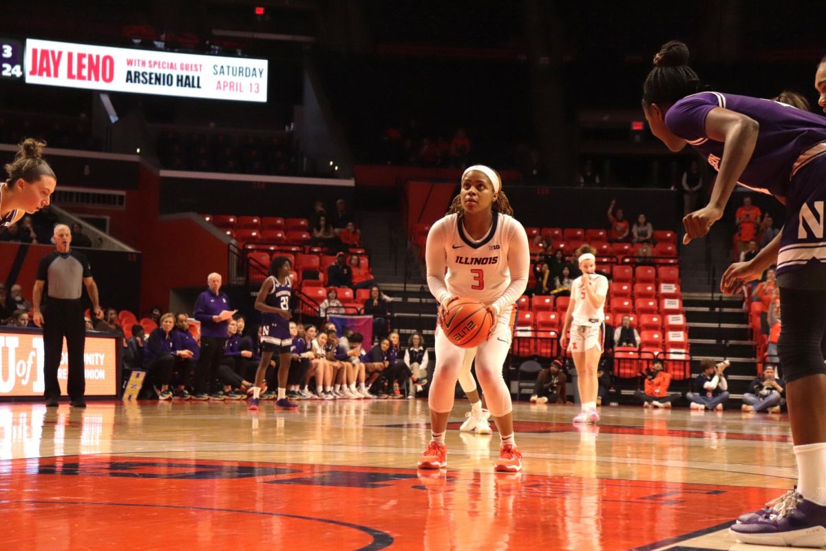 Fifth-year guard Makira Cook stands at the free throw line preparing to take a shot on Feb. 8 in the State Farm Center.