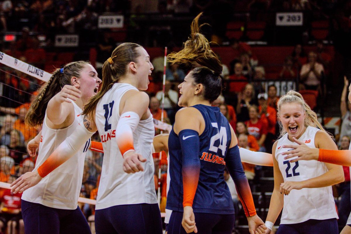 Illinois celebrates a point in a match against No. 2 Nebraska on Oct. 3.