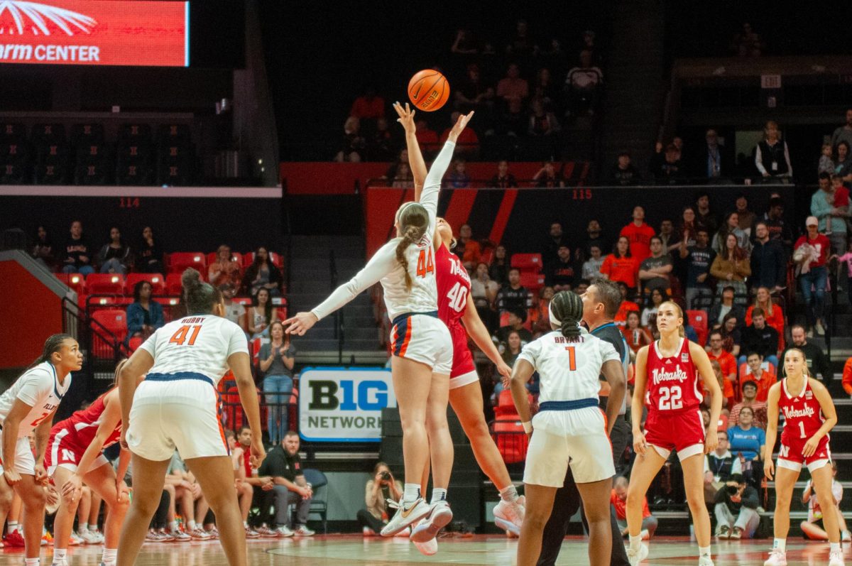 Fifth-year forward Kendall Bostic reaches up in tip-off during game against Nebraska on March 3.