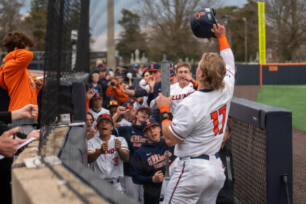 Junior catcher Camden Janik celebrates with his team in the dugout after crushing a homerun during a 17-6 win over Penn State on March 26. 