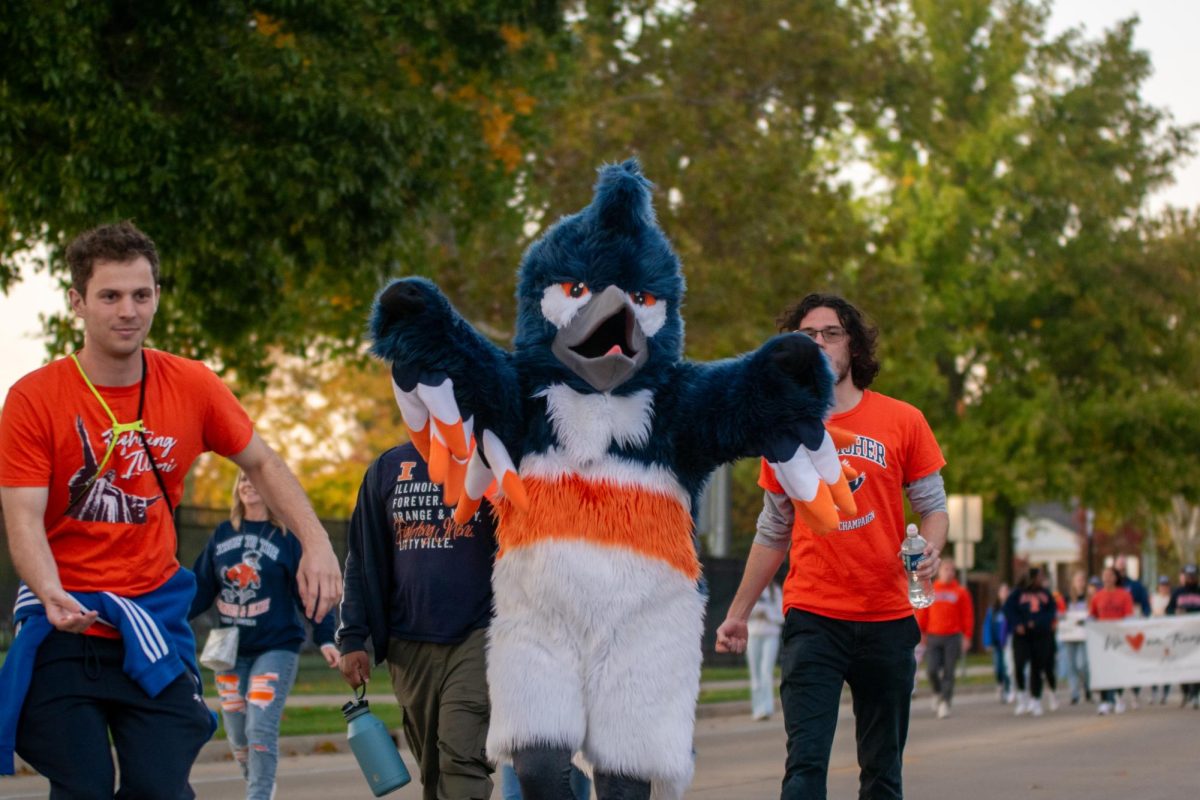 The Kingfisher marches in the 2023 Homecoming parade through campus on Oct. 20, 2023.