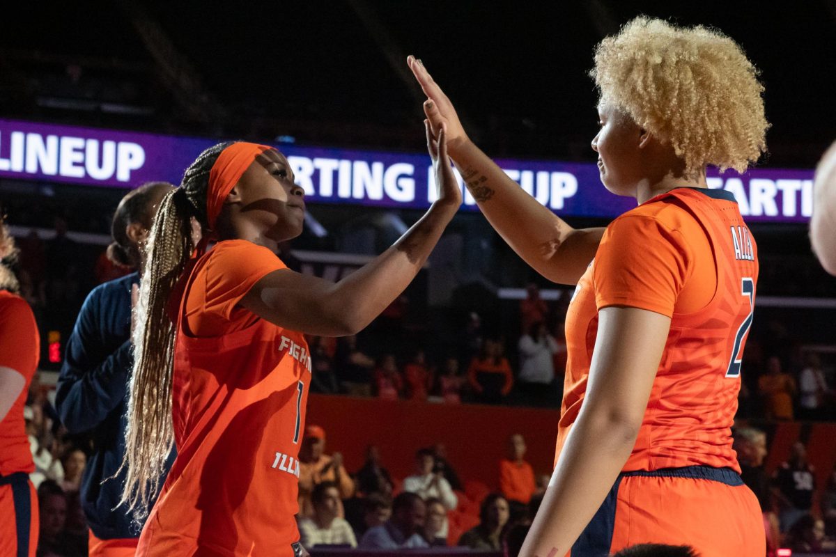 Fifth-year guard Genesis Bryant high fives sophomore guard Cori Allen before Illinois' game against Morehead State on Nov. 7, 2023.