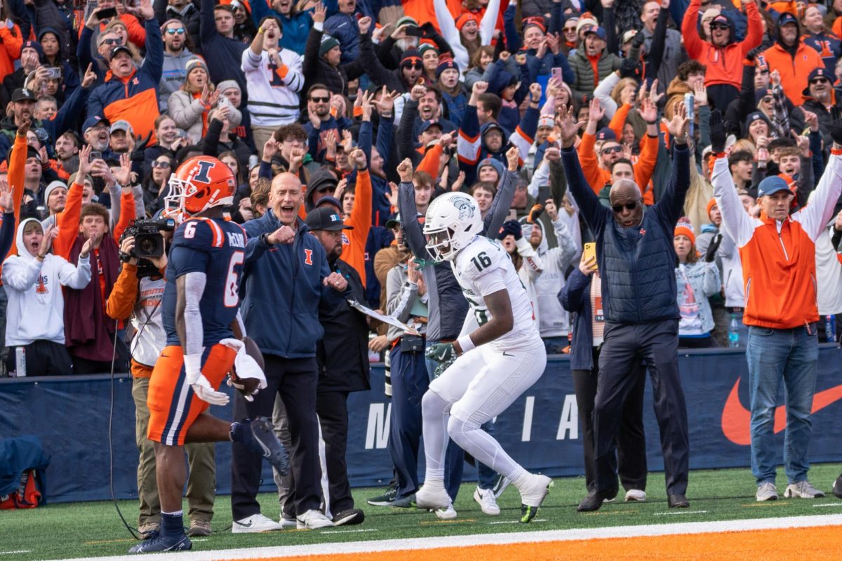 Junior running back Josh McCray waltzes into the end zone during Illinois’ dominant win over Michigan State on Nov. 16. Athletic Director Josh Whitman and Chancellor Robert Jones celebrate the score right next to the end zone. 