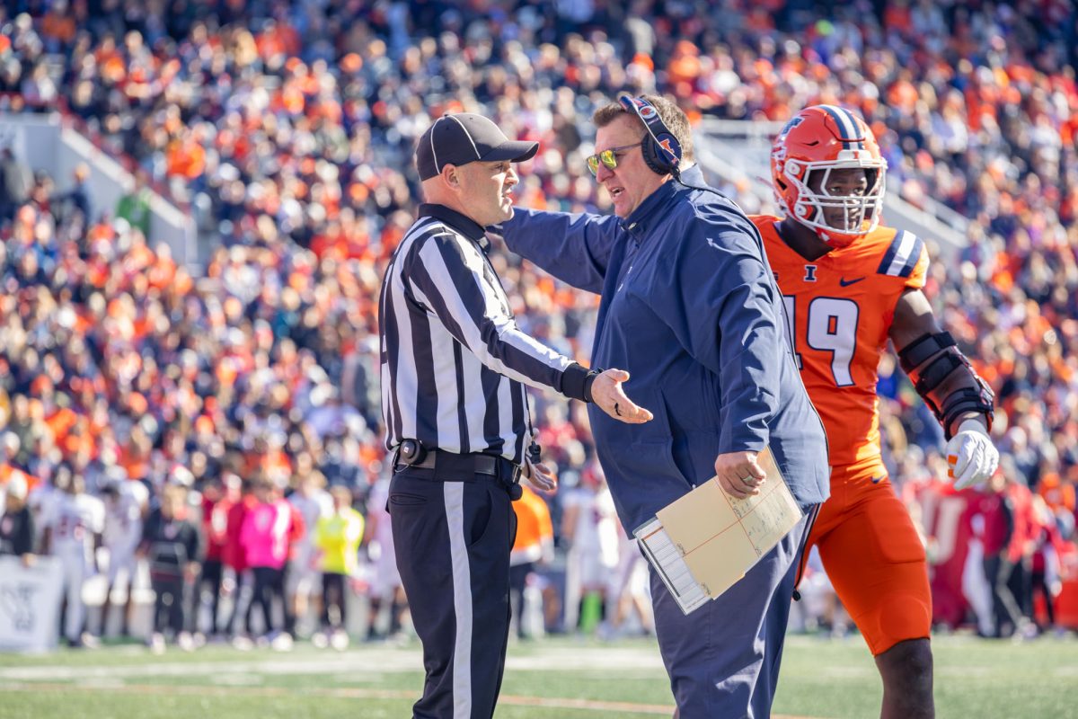 Head coach Bret Bielema talks with referee during game against Indiana on Nov. 11, 2023.