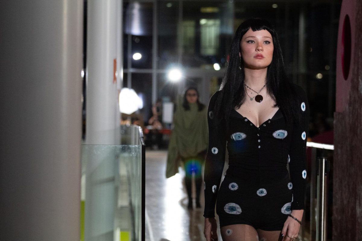 A model showcases a captivating outfit on the runway during the Circular Fashion Show’s biannual event, held Saturday at the Seibel Center for Design. The show emphasized creativity and sustainability, featuring designs made from upcycled materials and innovative techniques that promote environmental awareness in fashion.