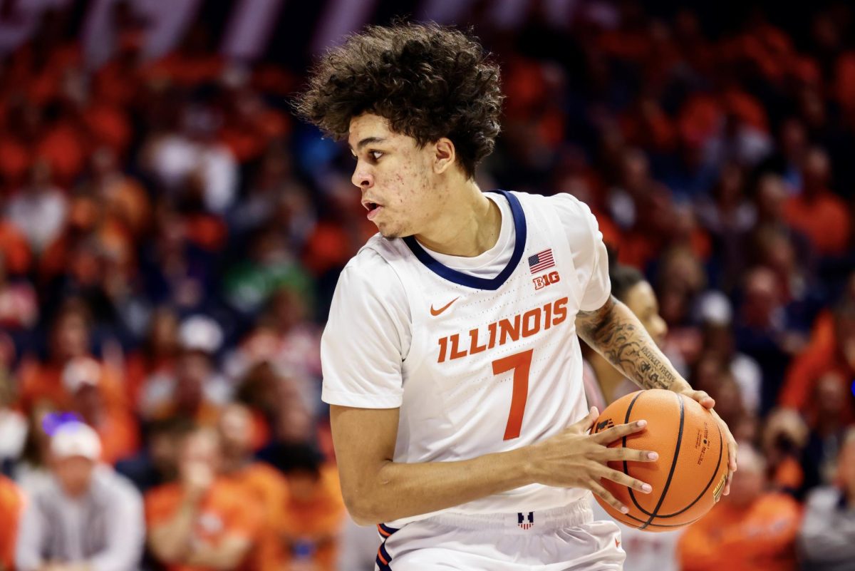 Freshman forward Will Riley handles the ball against Wisconsin on Dec. 10 at State Farm Center.