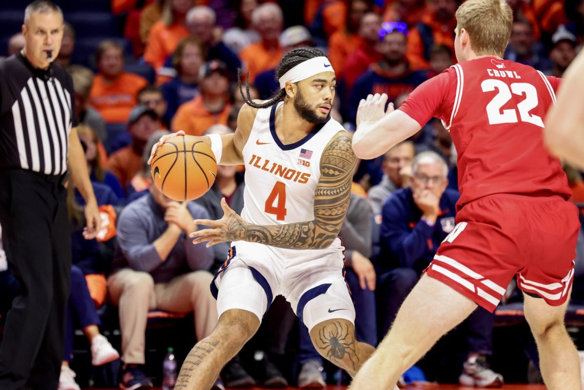 Junior guard Kylan Boswell dribbles the ball against No. 20 Wisconsin on Dec. 10.