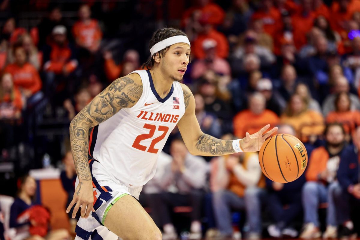 Junior guard Tre White dribbles the ball up the court against Wisconsin on Dec. 10.