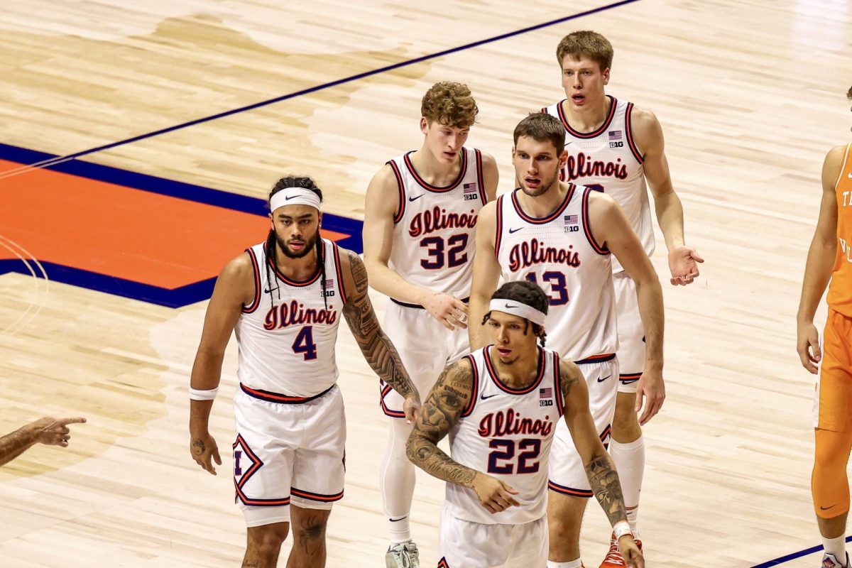 Junior guard Kylan Boswell, freshman guard Kasparas Jakučionis, sophomore center Tomislav Ivišić, graduate student forward Ben Humrichous and junior guard Tre White walk toward the bench on Dec. 14.