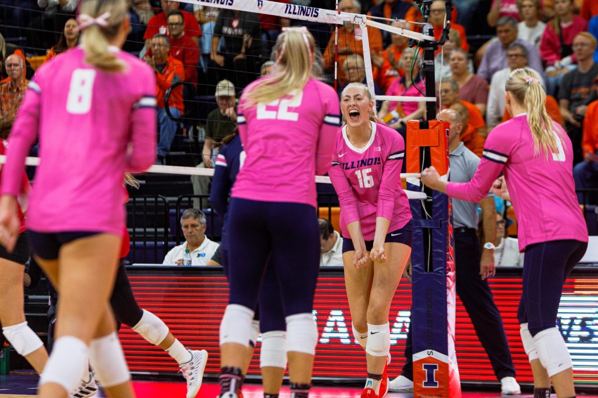 Freshman middle blocker Ashlyn Philpot secures a point for Illinois and turns to celebrate with her teammates on Oct. 16, 2024.