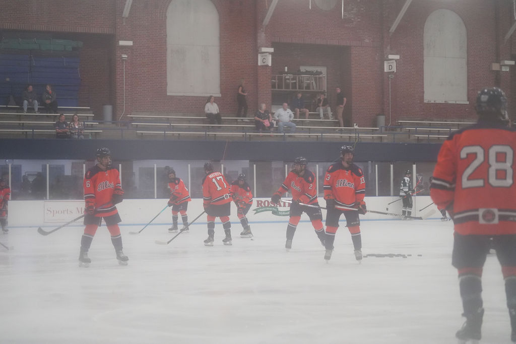 Illinois hockey forwards warm up before a matchup against Michigan State on Sept. 20. 