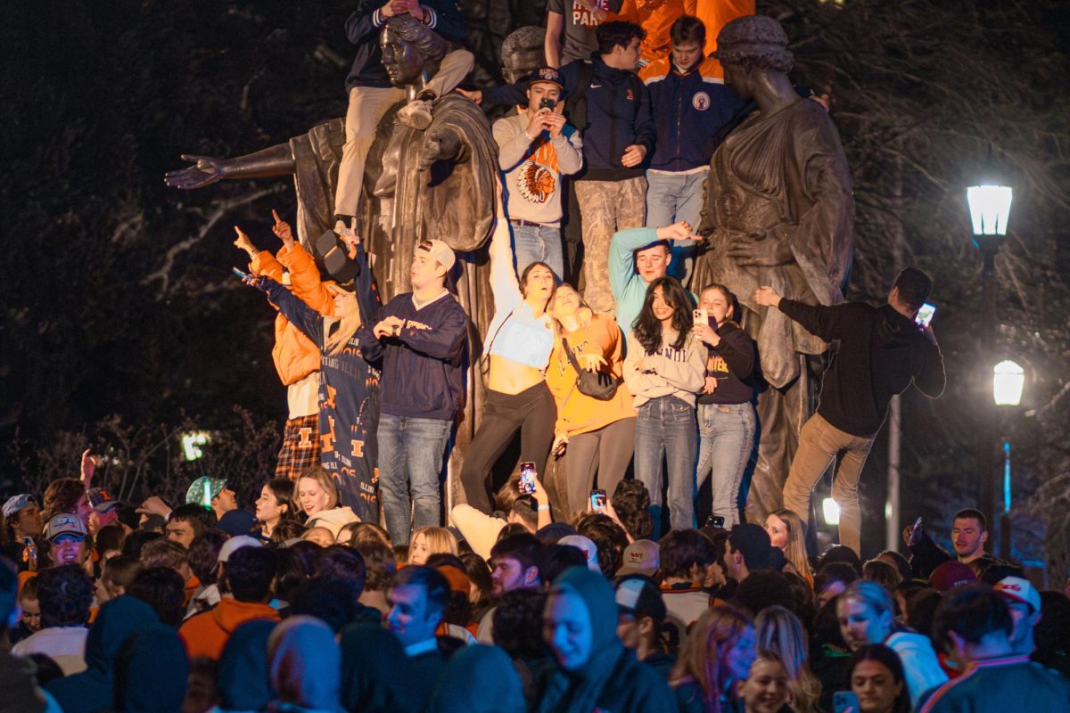 Students stormed Alma Mater following Illinoisʼ victory over Iowa State to advance to the Elite 8 on March 29.