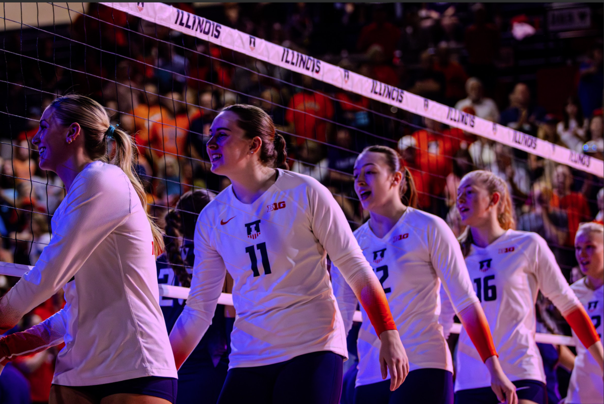 Illinois volleyball goes through handshake lines before its matchup against Northwestern at Huff Hall on Oct. 6.