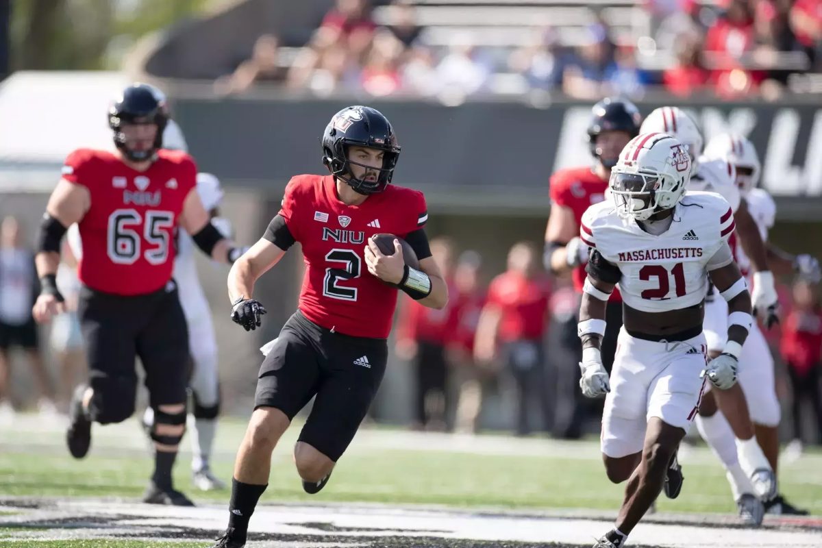 Redshirt Junior Ethan Hampton runs with the ball during a game against Massachusetts.