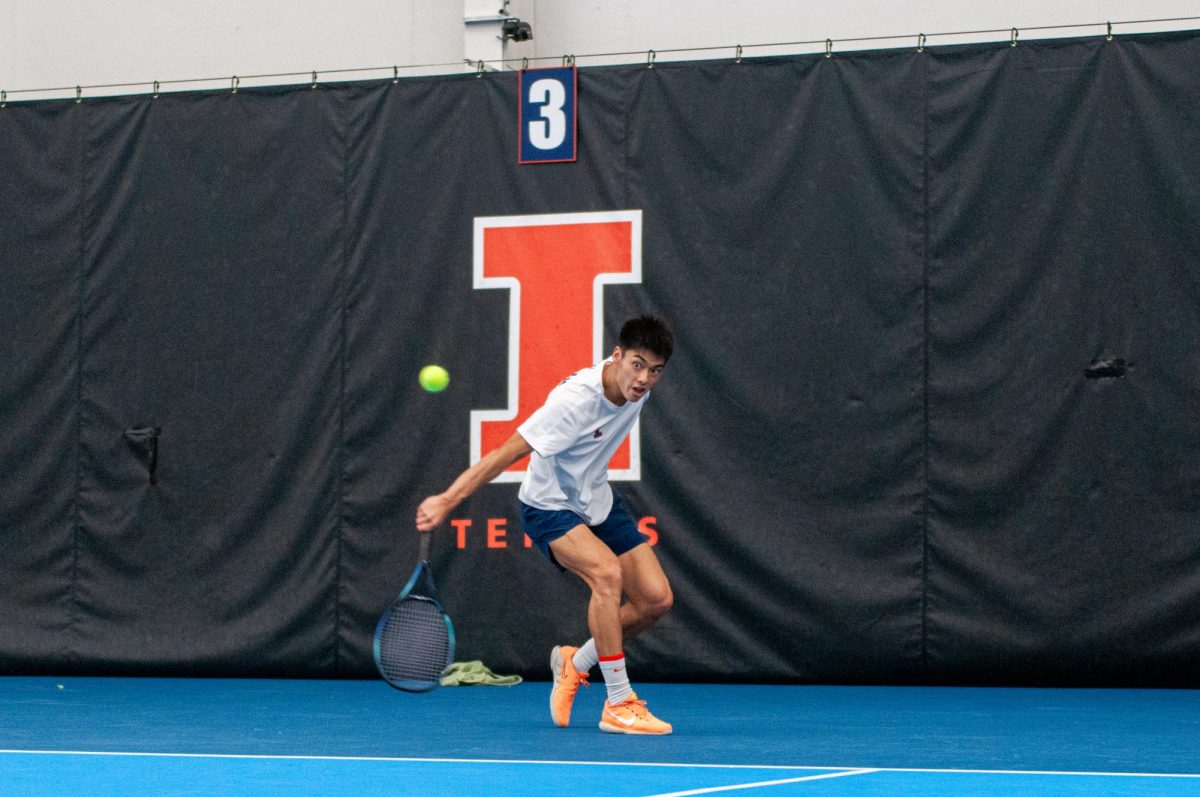 Junior Kenta Miyoshi makes contact with the tennis ball in the dual meet against Duke on Feb. 2, 2024.