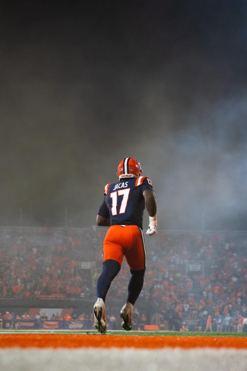 Junior outside linebacker Gabe Jacas walks out from Illinois' tunnel before the first home game of the 2024 season against Eastern Illinois on Aug. 29, 2024. 