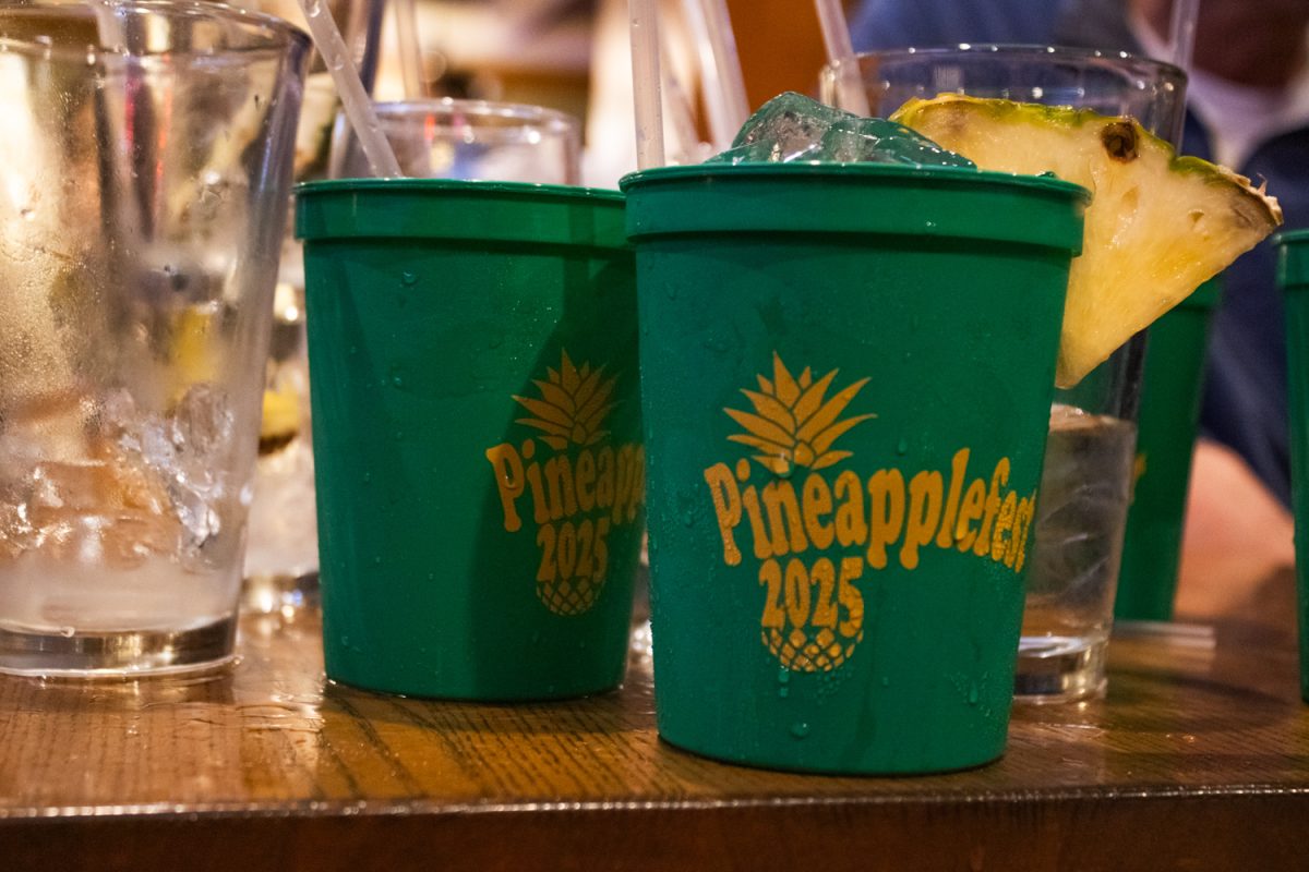 Guests received souvenir cups with their special pineapple-themed drinks Saturday at Esquire Lounge's third annual Pineapplefest 2025.