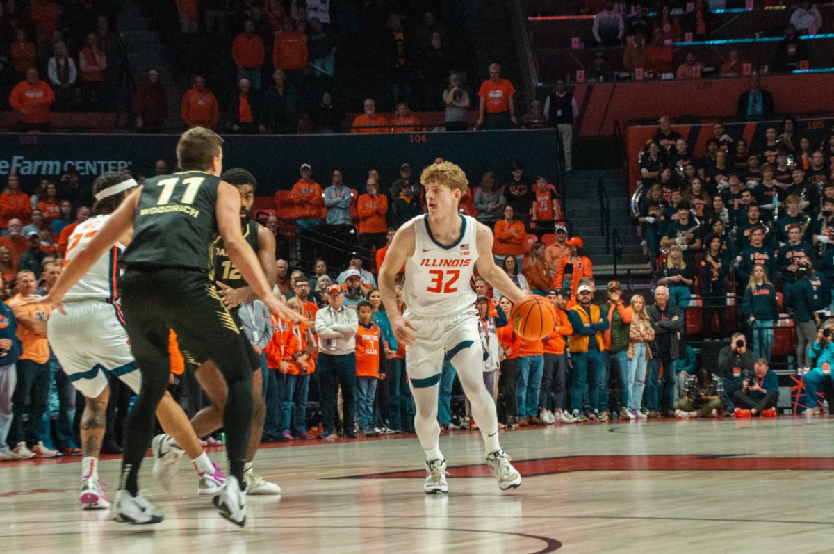 Freshman guard Kasparas Jakucionis takes a screen before driving to the basket in a win over Oakland on Nov. 13, 2024. 