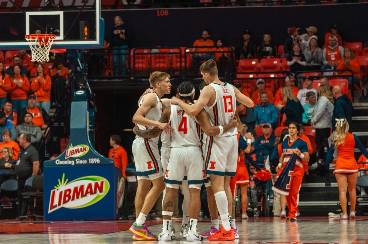 Illinois huddles up to discuss the game plan during a victory over Oakland on Nov. 13, 2024.