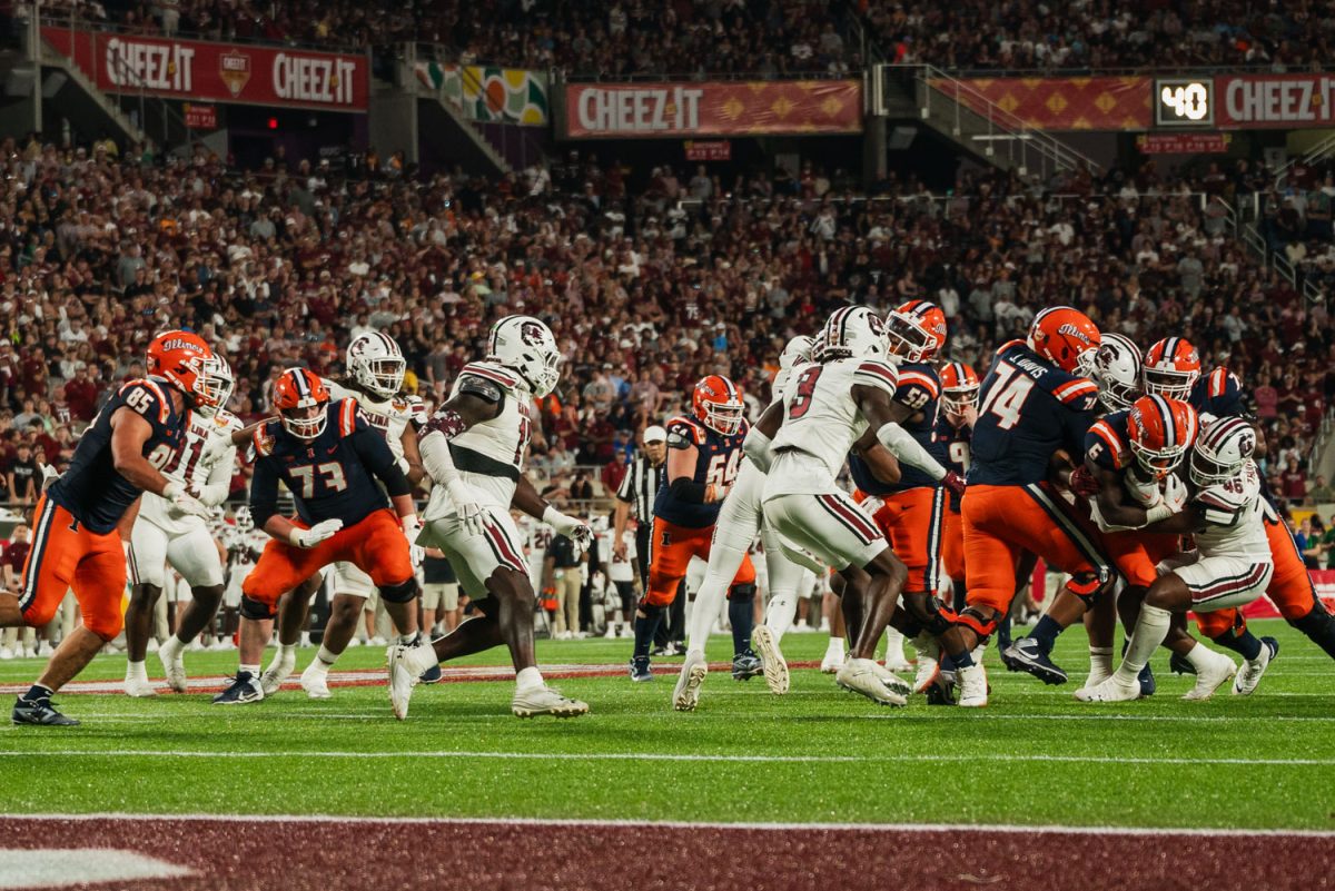 No. 20 Illinois runs the ball against No. 15 South Carolina at the Cheez-It Citrus Bowl on Dec. 31, 2024. 