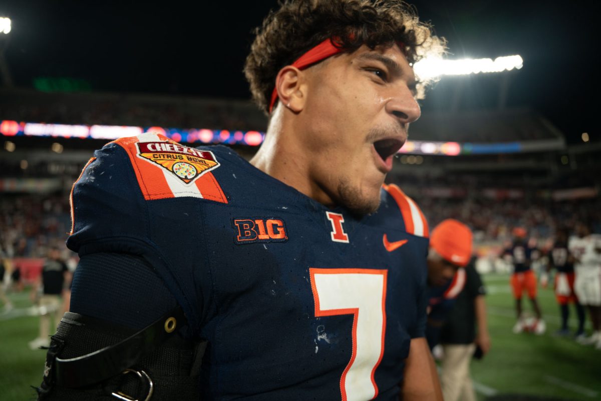 Sophomore defensive back Matthew Bailey shouts in celebration after Illinois takes home the Cheez-It Citrus Bowlt trophy after defeating South Carolina on Dec. 31, 2024.