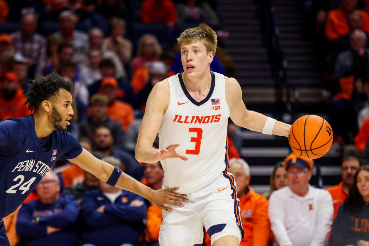 Graduate student forward Ben Humrichous handles the ball against Penn State on Jan. 8.