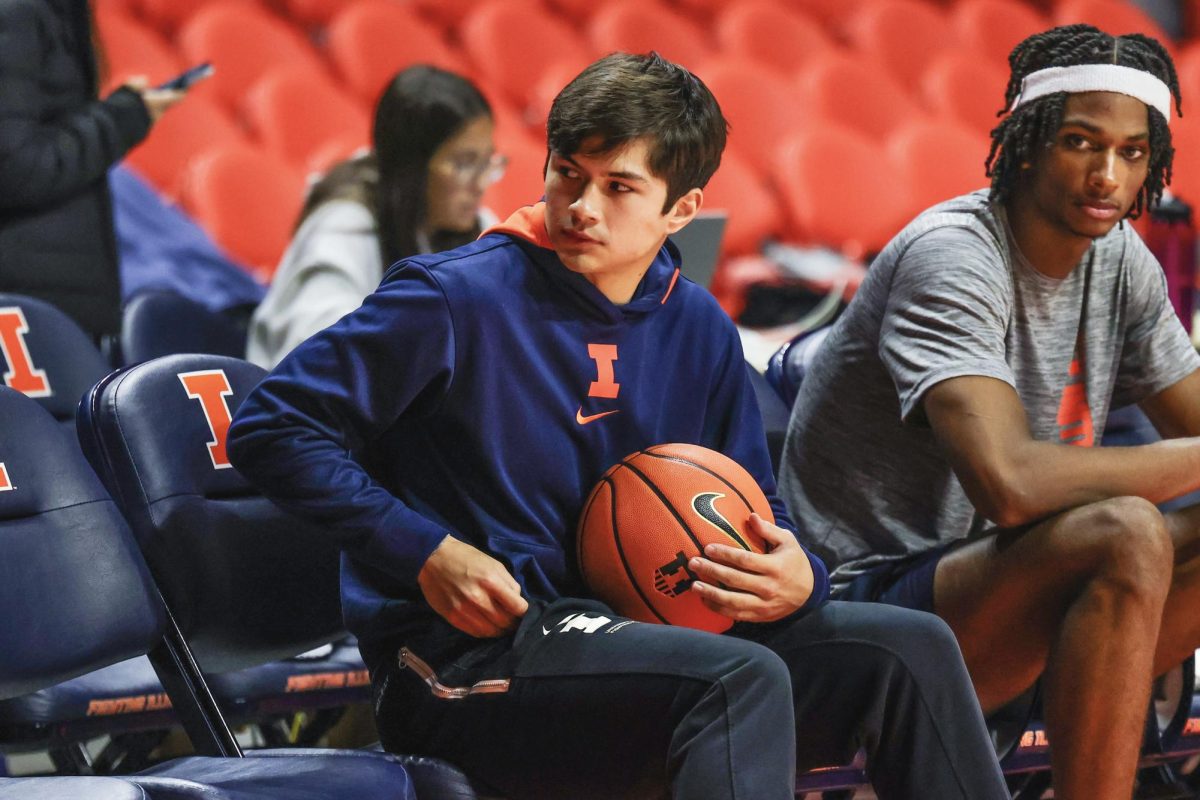 Former Illini guard Max Williams (left) sits next to current Illini forward Carey Booth (right) at the team’s Nov. 7, 2024 practice at State Farm Center.