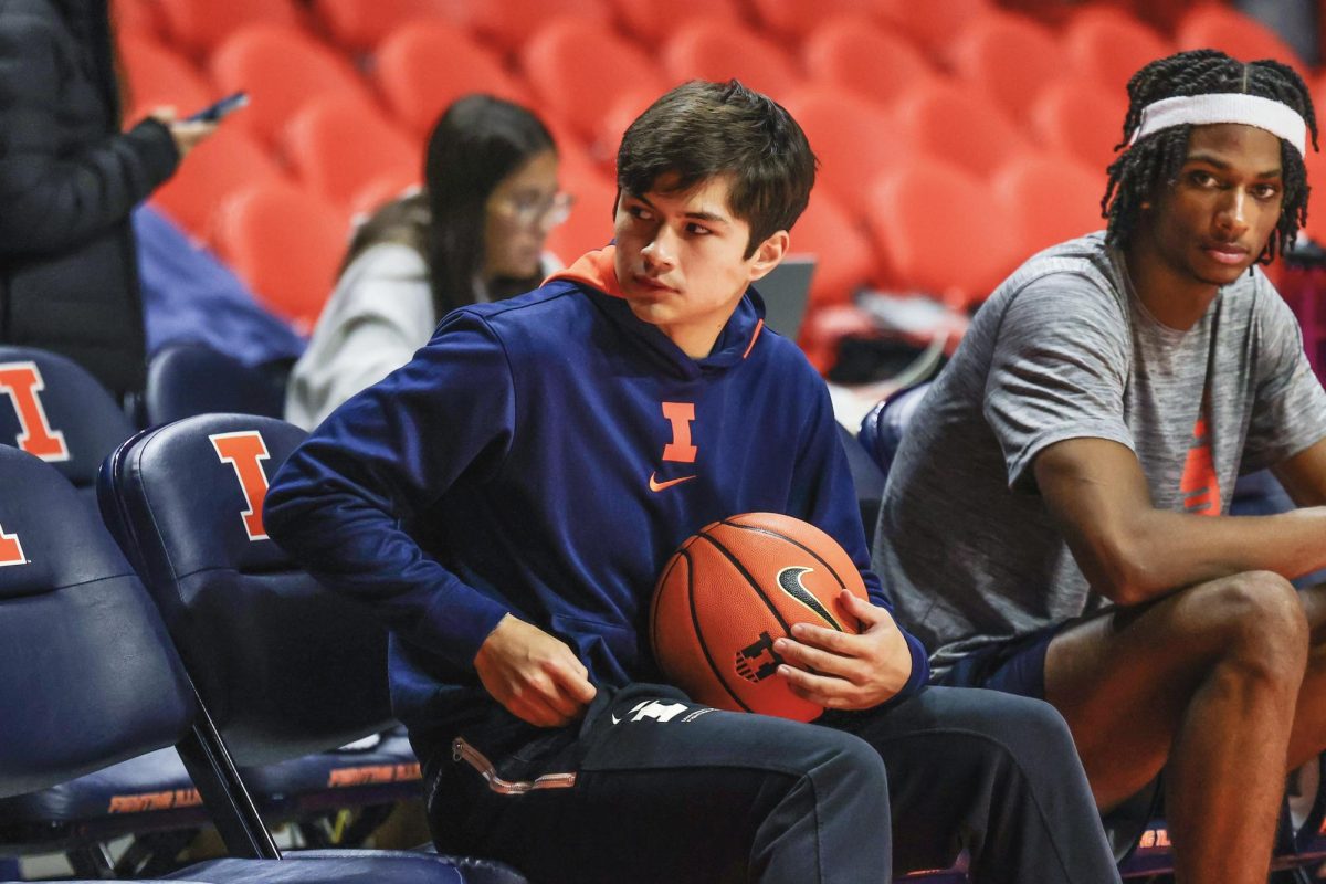 Former Illini guard Max Williams (left) sits next to current Illini forward Carey Booth (right) at the team’s Nov. 7, 2024 practice at State Farm Center.