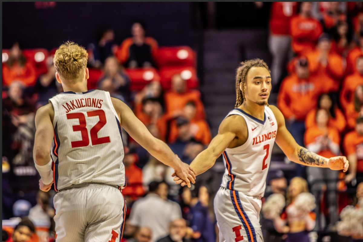 Freshman guard Kasparas Jakučionis gives sophomore guard Dra Gibbs-Lawhorn a high-five as the two get back on defense in a loss to Maryland on Jan. 23.