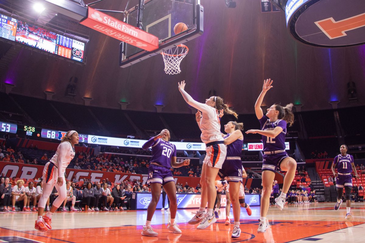 Fifth-year forward Kendall Bostic and Northwestern Wildcats watch as the ball  goes toward the hoop in the matchup on Feb. 8, 2024.