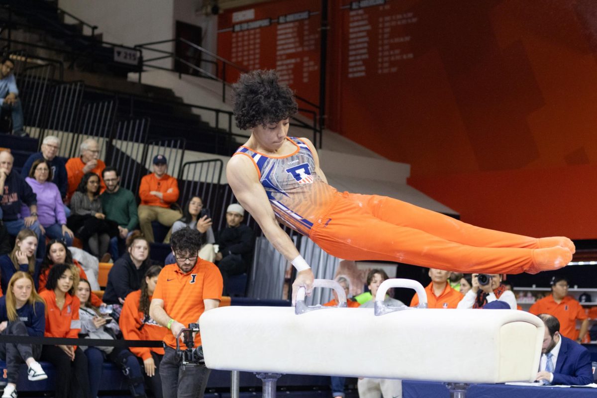 Freshman Ian Sandoval maintains strength on the pommel horse at a meet against No. 4 Nebraska on Jan. 31.