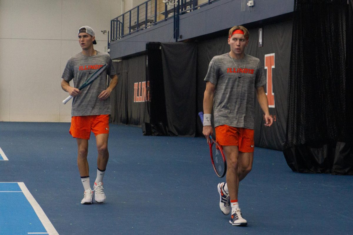 Illinois' duo of redshirt junior William Mroz and senior Mathis Debru get in position for the No. 2 doubles match against Notre Dame on Feb. 15.