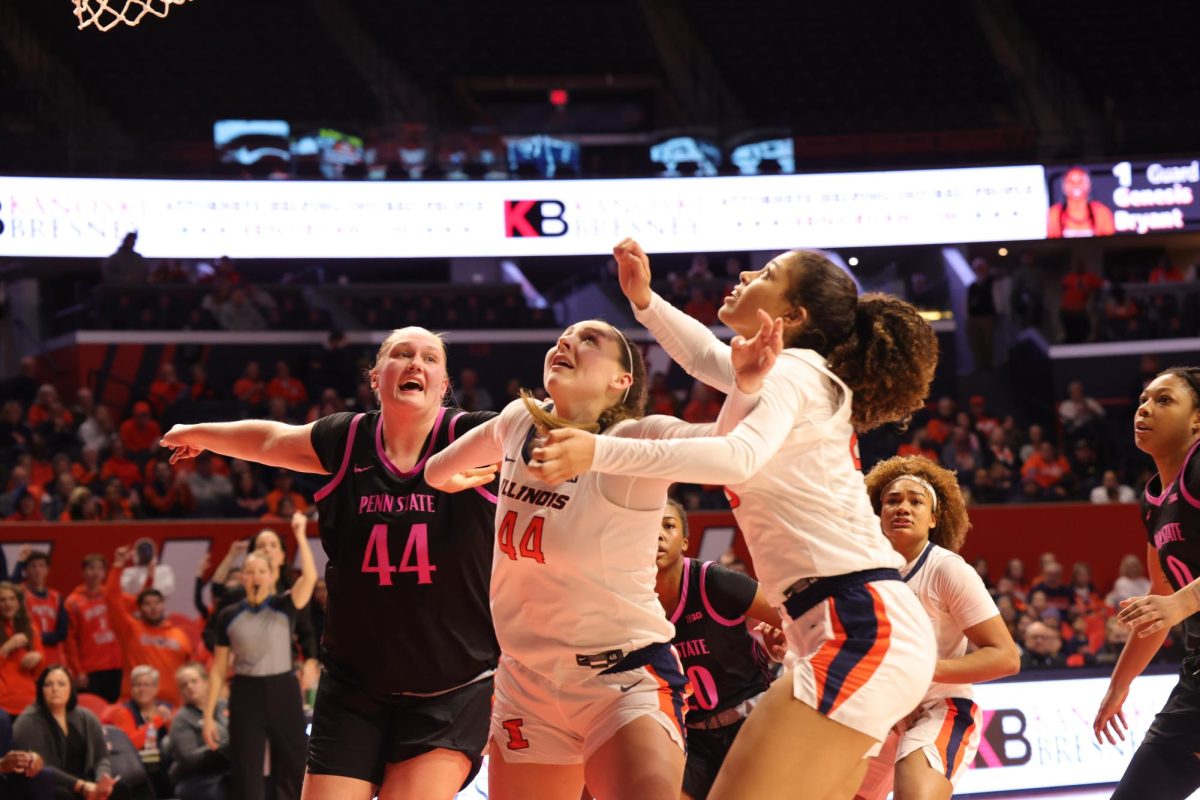 Fifth-year forward Kendall Bostic and senior forward Brynn Shoup-Hill fight for a rebound under the basket during a game against Penn State on Feb. 13. 